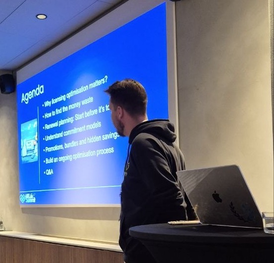 Eetu Hämäläinen presenting his agenda slide in the Landing room at HELish Summit 2026