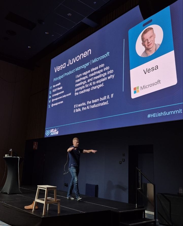 Vesa Juvonen, Principal Product Manager at Microsoft, on stage at HELish Summit 2026 with his intro slide