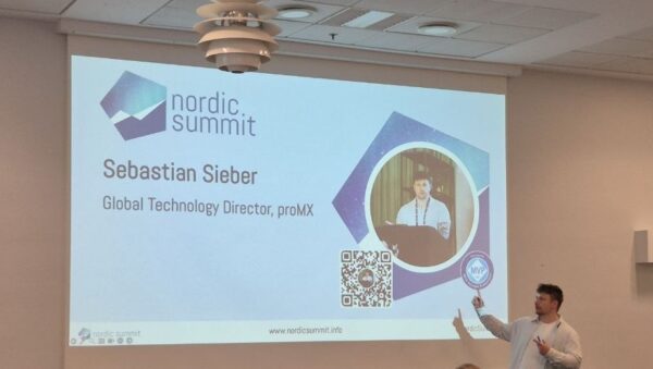 Sebastian Sieber, Global Technology Director at proMX, pointing at his intro slide at Nordic Summit 2026