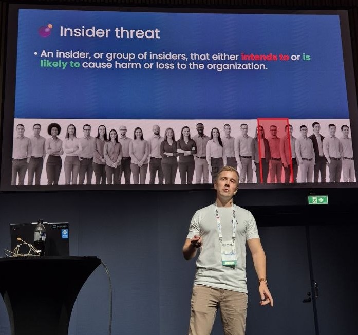 Slide defining insider threat as an insider, or group of insiders, that either intends to or is likely to cause harm or loss to the organization