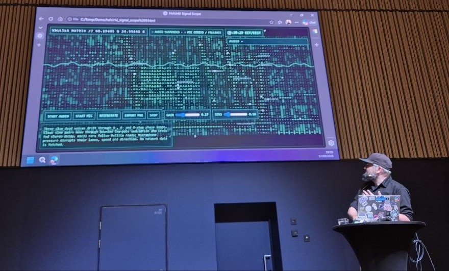 Tero Niemi demoing Helsinki Signal Scope, an ASCII visualisation driven by the microphone