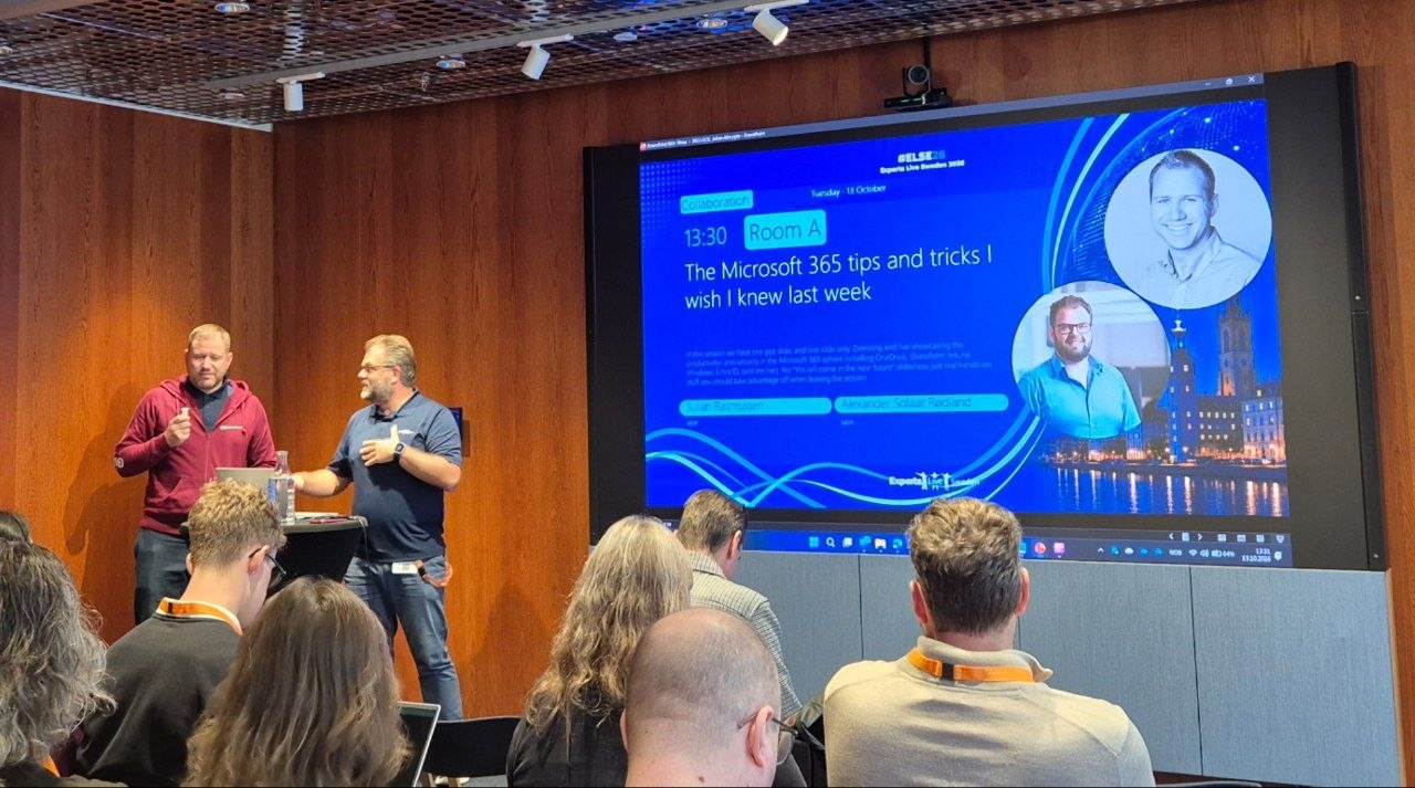 Julian Rasmussen and Alexander Solaat Rødland in Room A in front of their title slide, The Microsoft 365 tips and tricks I wish I knew last week