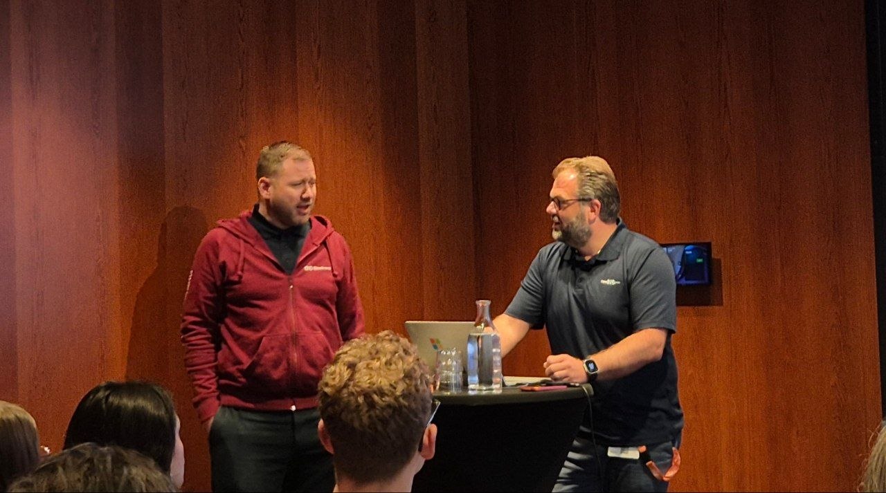 Julian Rasmussen and Alexander Solaat Rødland on stage in Room A at Experts Live Sweden 2026
